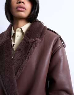 Model wearing Longline funnel oversized aviator borg coat in chocolate