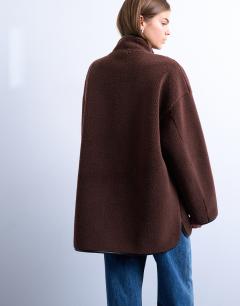 Model wearing Longline high neck chuck on shearling in chocolate