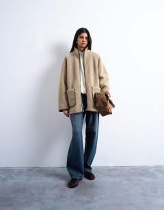 Model wearing Longline high neck chuck on shearling in teddy