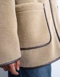 Model wearing Longline high neck chuck on shearling in teddy