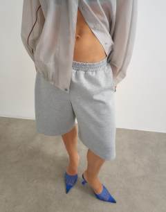 Model wearing Longline jersey short in grey