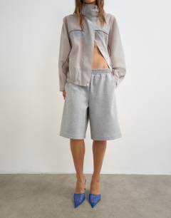 Model wearing Longline jersey short in grey
