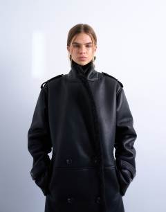 Model wearing Longline oversized aviator borg coat in black