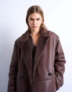 Model wearing Longline oversized aviator borg coat in chocolate