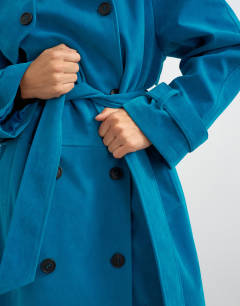 Model wearing Longline oversized faux suede trench coat in blue
