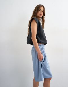 Model wearing Longline piping detail sports shorts in light blue