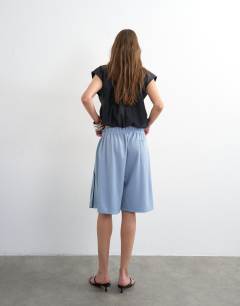 Model wearing Longline piping detail sports shorts in light blue