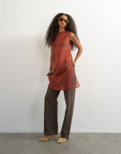 Model wearing Longline sheer organza tunic in rust