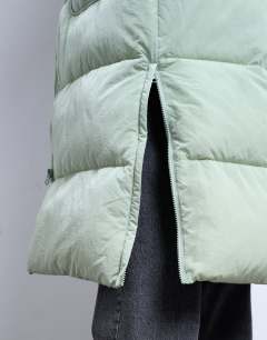 Model wearing Longline techy puffer jacket in green sage