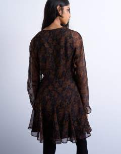 Model wearing Longsleeve lace trim mini tea dress in dark based floral