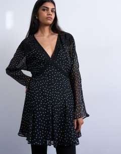 Model wearing Longsleeve lace trim mini tea dress in mono spot