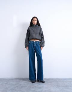 Model wearing Lounge low rise jean in vintage blue