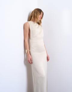 Model wearing Low armhole maxi occasion dress in oyster