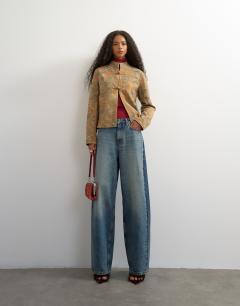 Model wearing Low rise baggy boyfriend jean in mid blue