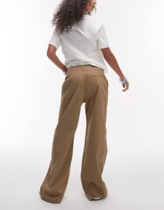 Model wearing Low rise casual tailored straight leg trouser in beige