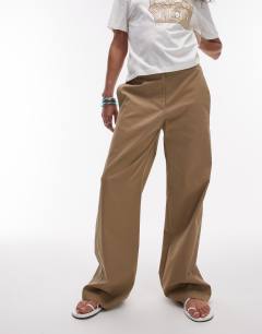 Model wearing Low rise casual tailored straight leg trouser in beige