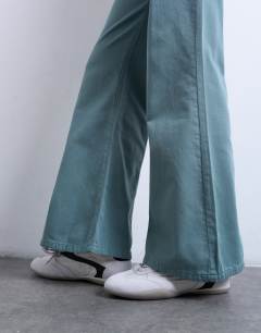 Model wearing Low rise flared trouser in blue 