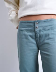 Model wearing Low rise flared trouser in blue 