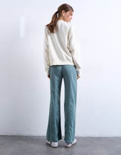 Model wearing Low rise flared trouser in blue 