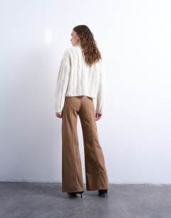Model wearing Low rise flared trouser in brown