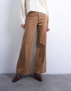 Model wearing Low rise flared trouser in brown