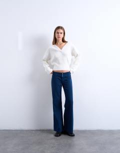 Model wearing Low rise flared trouser in navy