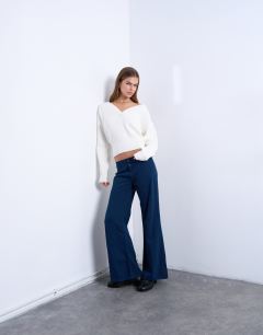 Model wearing Low rise flared trouser in navy