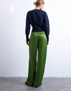 Model wearing Low rise satin trouser in green