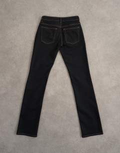 Model wearing Low rise slim leg jean in black