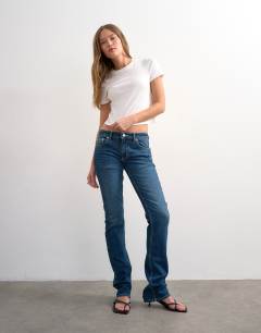 Model wearing Low rise slim leg jean in rich blue