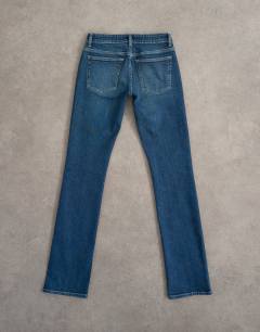 Model wearing Low rise slim leg jean in rich blue