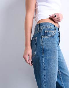 Model wearing Low rise straight leg jean in vintage blue