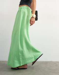 Model wearing Low slung full circle maxi skirt in green stripe