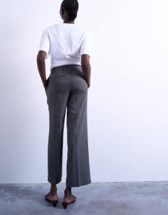 Model wearing Low slung slouchy straight leg trouser in grey