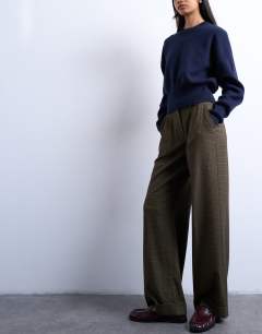Model wearing Low slung tailored trouser in green heritage check