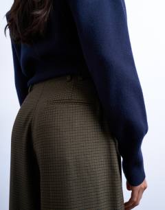 Model wearing Low slung tailored trouser in green heritage check