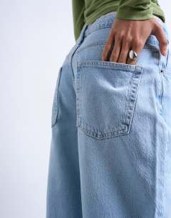 Model wearing Lowrie low rise baggy jean in bleach