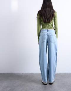 Model wearing Lowrie low rise baggy jean in bleach