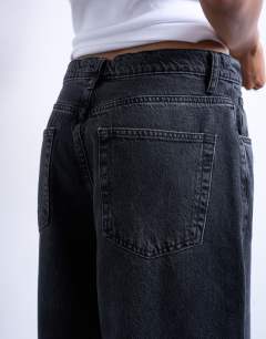 Model wearing Lowrie low rise baggy jean in washed black