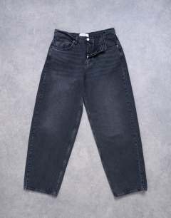 Model wearing Lowrie low rise baggy jean in washed black