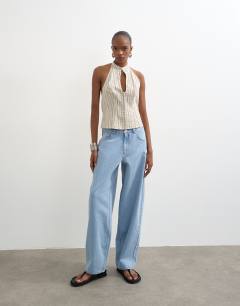 Model wearing Lowrie low rise baggy jeans in bleach