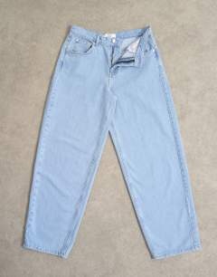 Model wearing Lowrie low rise baggy jeans in bleach