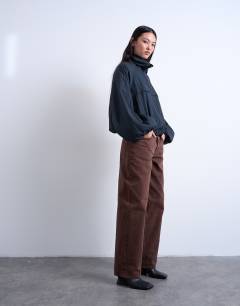 Model wearing Lowrie low rise baggy jeans in chocolate