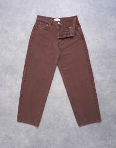 Model wearing Lowrie low rise baggy jeans in chocolate