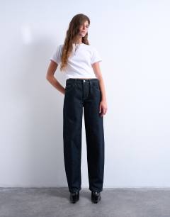 Model wearing Lowrie low rise baggy jeans in indigo rinse