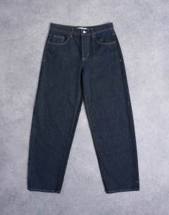 Model wearing Lowrie low rise baggy jeans in indigo rinse