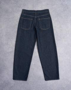 Model wearing Lowrie low rise baggy jeans in indigo rinse