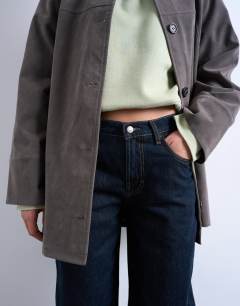 Model wearing Lowrie low rise baggy jeans in indigo rinse