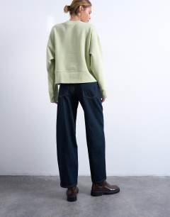 Model wearing Lowrie low rise baggy jeans in indigo rinse