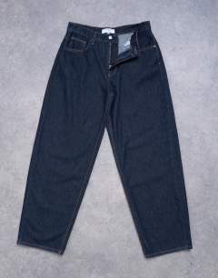 Model wearing Lowrie low rise baggy jeans in indigo rinse